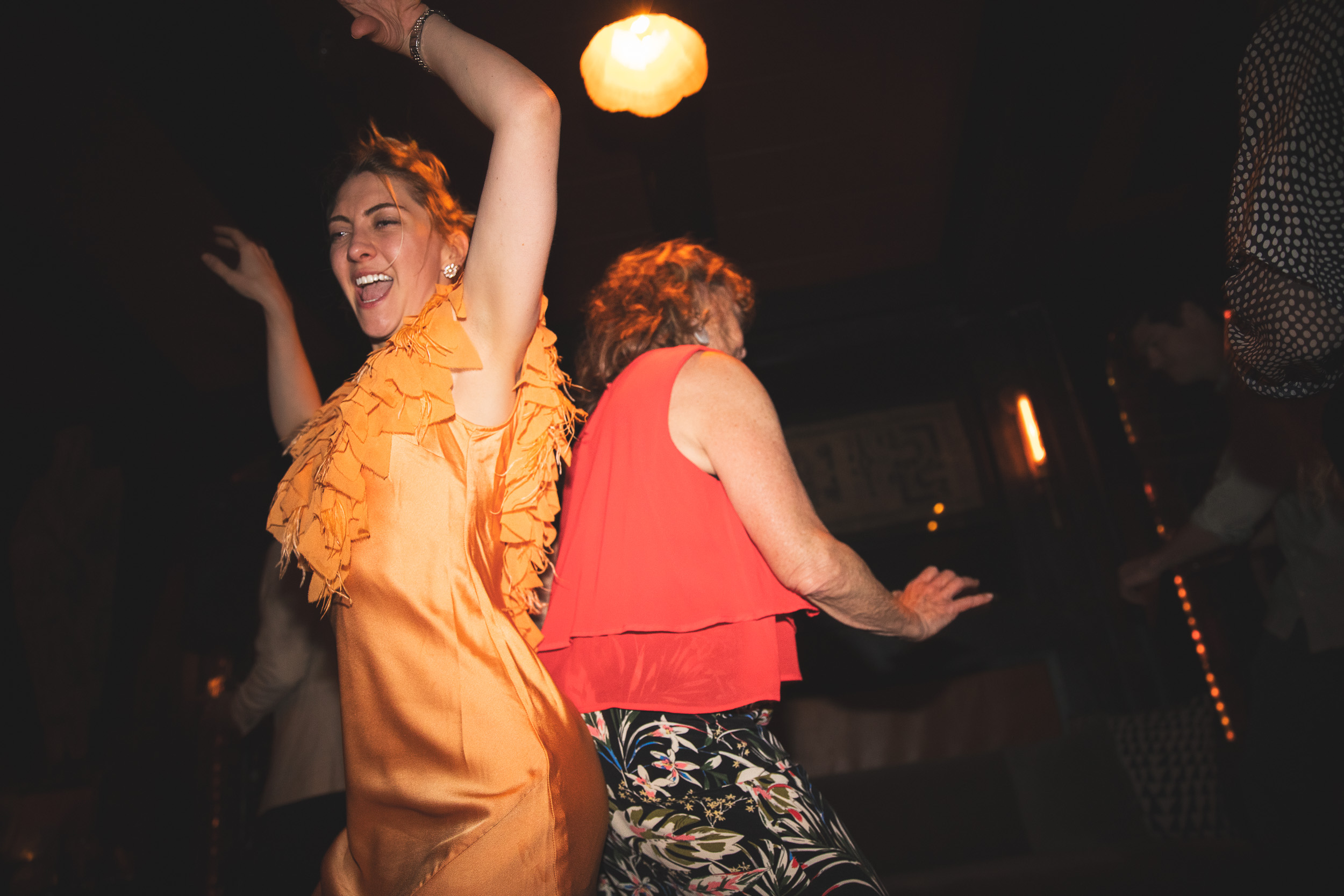 Dance floor, woman in orange dress spinning